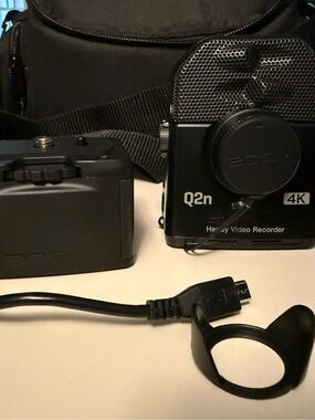 Zoom Q2n 4K Handy Video Recorder w/ tripod, bag, and extra battery pack case.